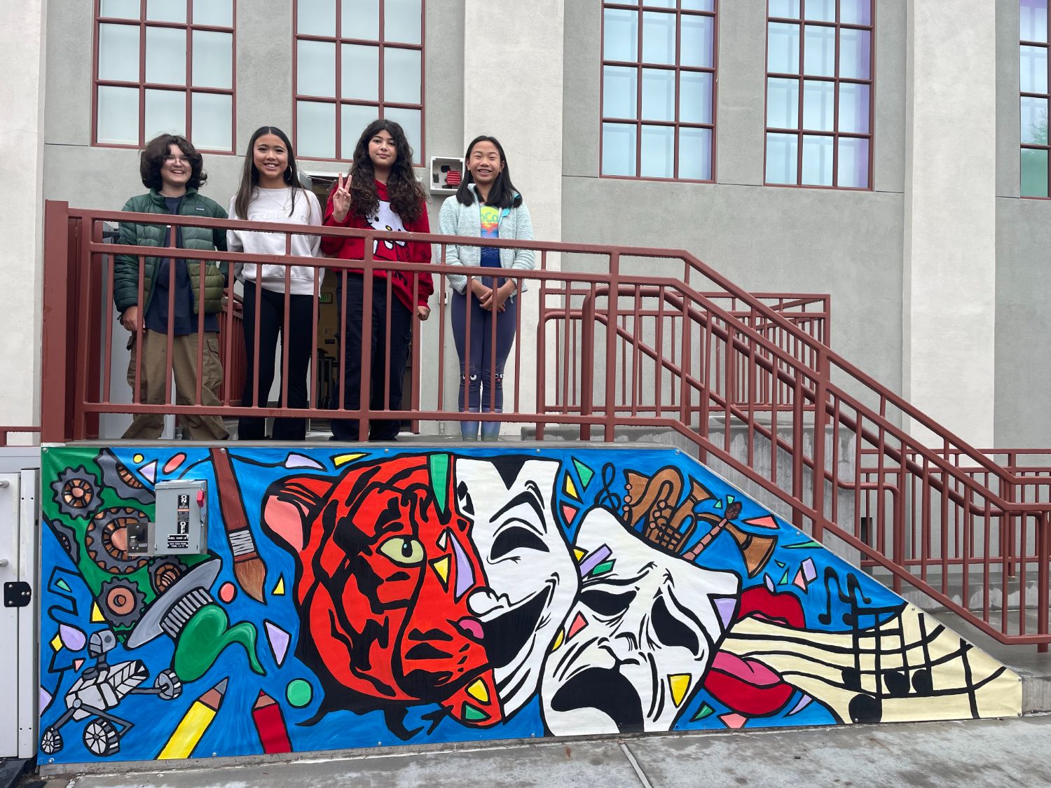 PHOTO: Denise Tanaka | The South Pasadenan | SPMS students gather around a newly completed banner on the middle school Arts Building.