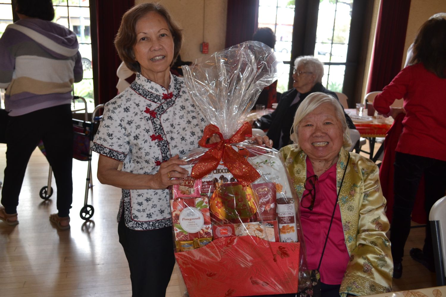 PHOTO: Alisa Hayashida | The South Pasadenan | Jessie Ivins and Irene Wong are very excited about these chocolates that they won at the Lunar New Year luncheon hosted by the Senior Center and South Pasadena Chinese American Club.