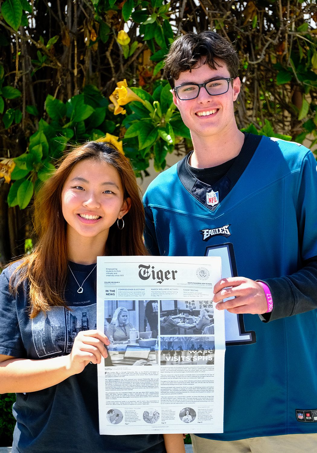 PHOTO: Emiko Essmiller (provided by SPUSD) | Tiger Newspaper Editor-in-Chief Hanna Bae (left) and Online Managing Editor Benjamin Regan (right) hold an issue from March 2023.