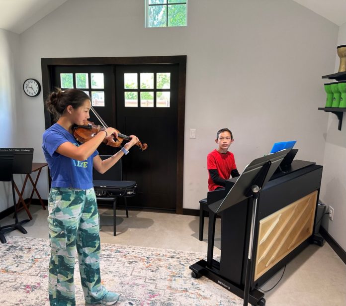 Photo: Rebecca Ward | South Pasadenan | Juniper Chao (violin) and William Hubbard (piano) perform Wolfgang Amadeus in the Carriage House of the South Pasadena Conservatory of Arts and Music Mozart's Sonata in G major.