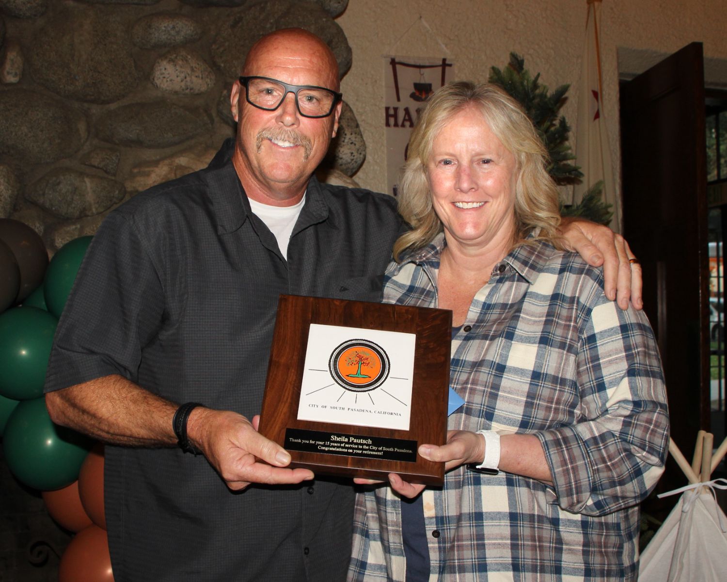 PHOTO: Henk Friezer | The South Pasadenan | South Pasadena Community Services Director, Sheila Pautsch, receives a plaque from Fire Chief Paul Riddle at her retirement party.