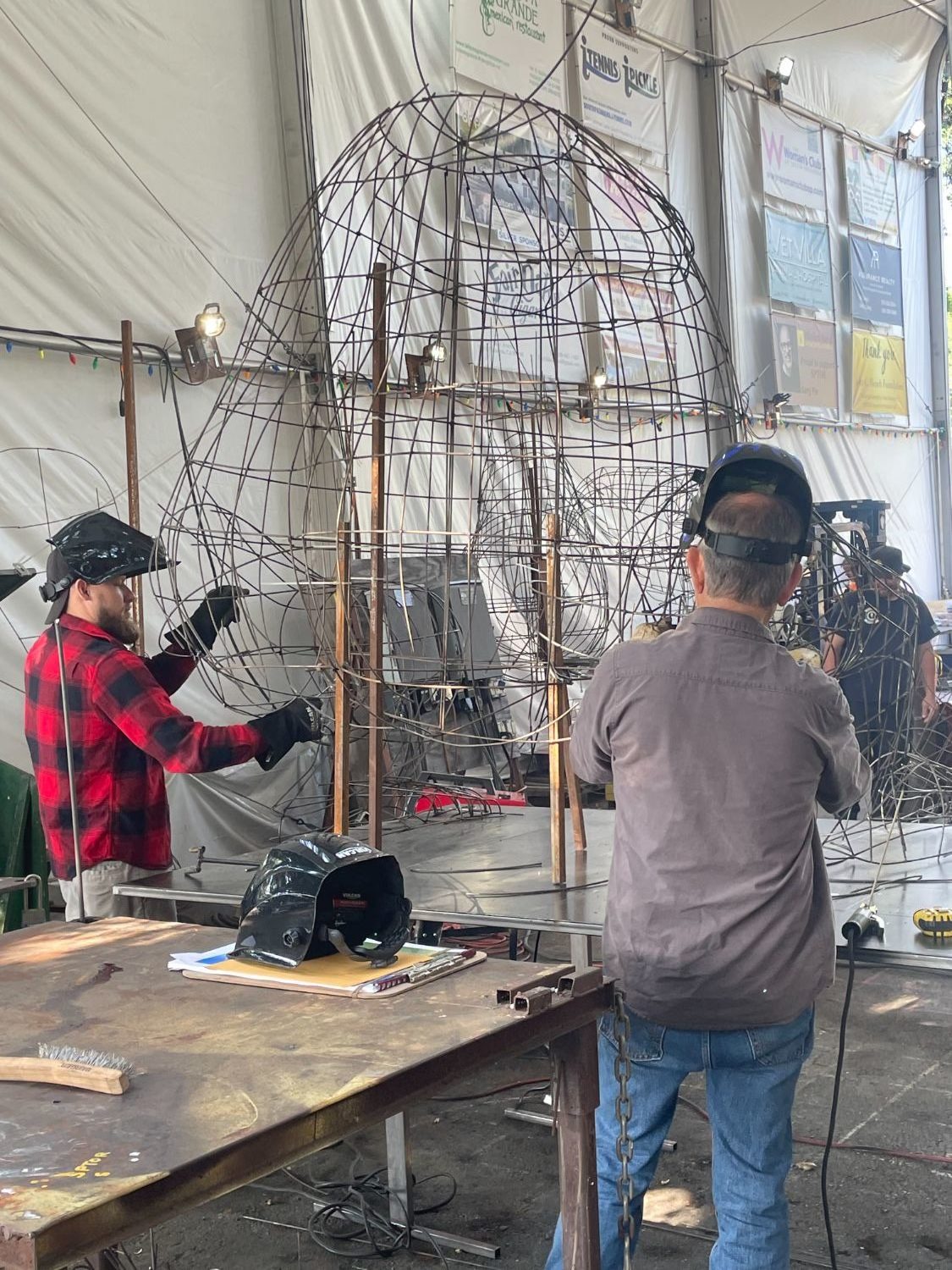 Construction crew members (left to right) Bryce Quinn and Kris Nagle create the orangutang that will appear on “Boogie Fever,” South Pasadena’s 2024 float.
