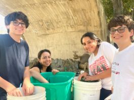 PHOTO: Sally Kilby | The South Pasadenan | Volunteers count vials for flowers Oct. 7 in order to determine how many more need to be ordered. Thousands of vials will be used on the float. L-R are Sebastian Adams, Mellany Becerra, Julia Lopez and Diego Adams.