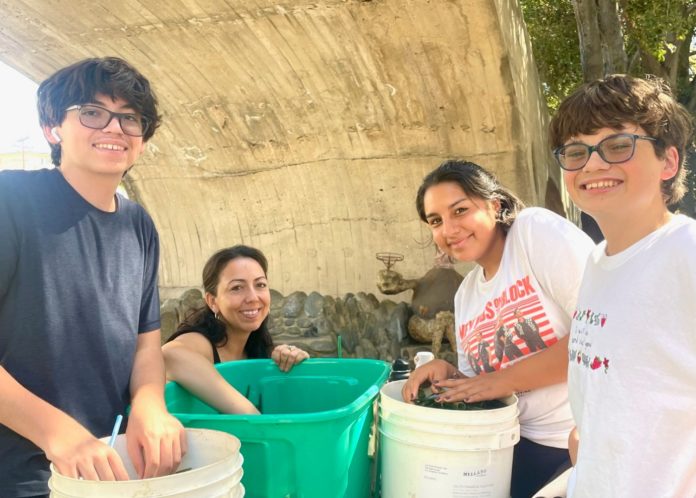 PHOTO: Sally Kilby | The South Pasadenan | Volunteers count vials for flowers Oct. 7 in order to determine how many more need to be ordered. Thousands of vials will be used on the float. L-R are Sebastian Adams, Mellany Becerra, Julia Lopez and Diego Adams.