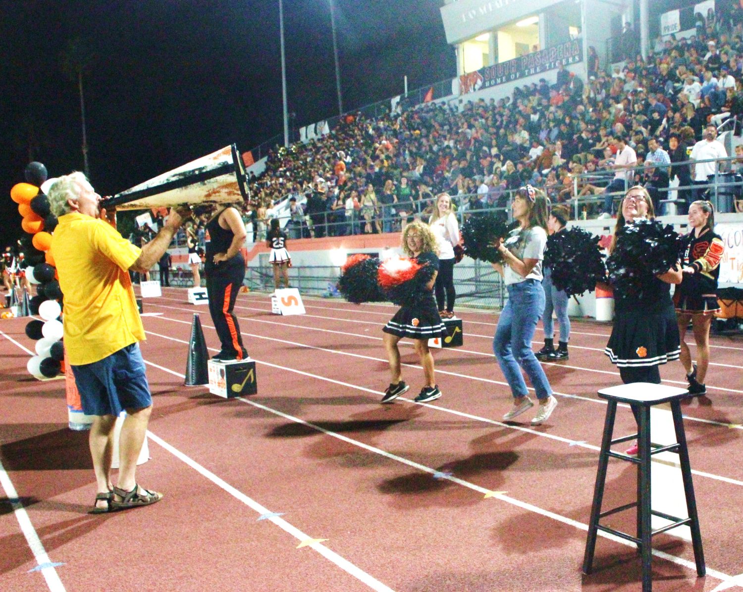 PHOTO: Henk Friezer | The South Pasadenan | Alumni join current SPHS cheerleaders on the field for Homecoming 2023.