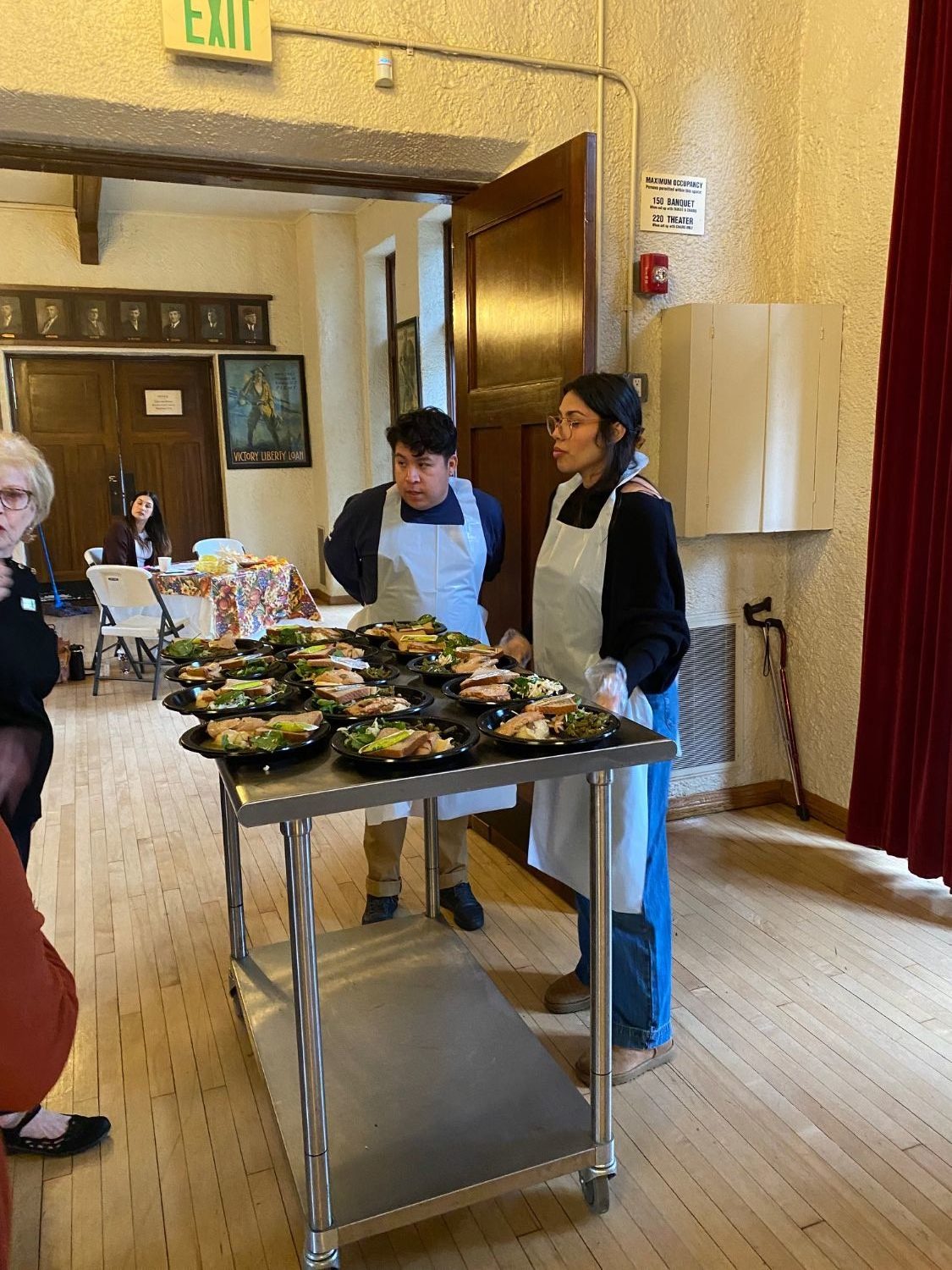 PHOTO: Alisa Hayashida | The South Pasadenan | Senior Center staff serves a Thanksgiving meal to seniors at the War Memorial Building in South Pasadena.