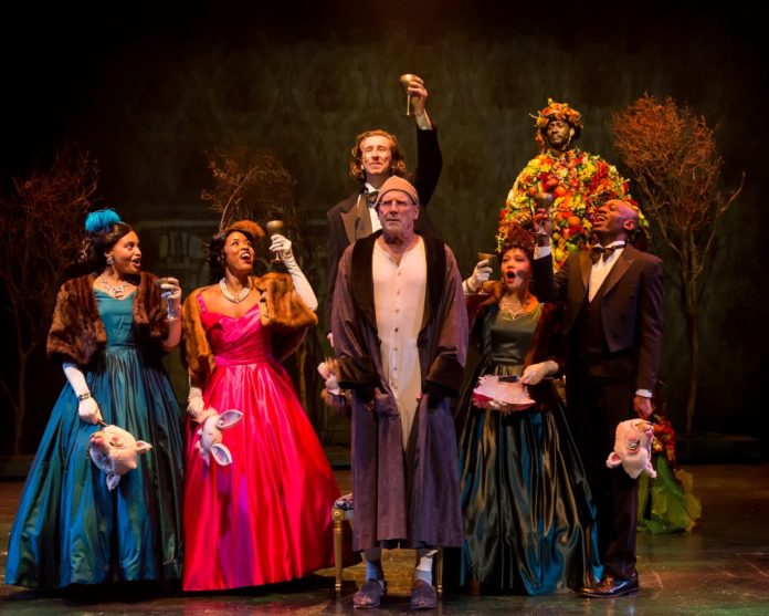 PHOTO: Craig Schwartz | The South Pasadenan | Geoff Elliot as Ebenezer Scrooge and the cast of A Christmas Carol at A Noise Within.