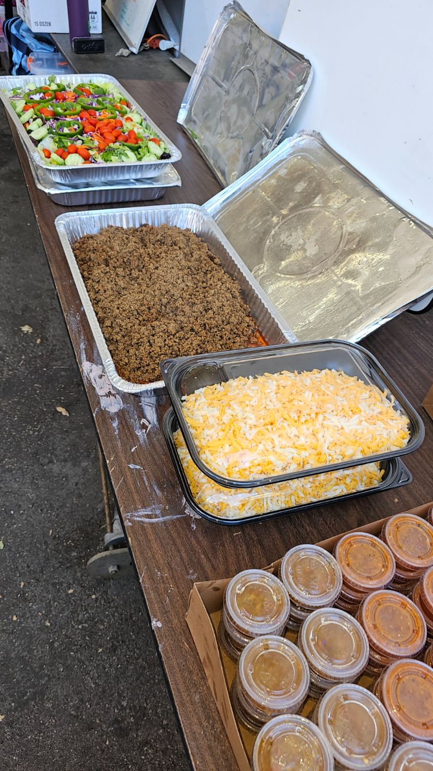 PHOTO: Steve Fillingham | The South Pasadenan | Buffet lunch from Hi-Life Burgers consisting of taco salad awaits hungry volunteers at the War Memorial Building float site.