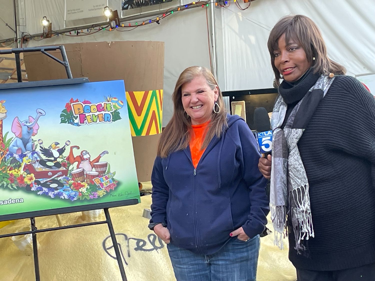 PHOTO: Sally Kilby | The South Pasadenan | PHOTO: Sally Kilby | SPTOR Decoration Chair, Janet Benjamin, with KTLA's Gayle Anderson paying a visit to the South Pasadena Tournament of Roses float site on December 11, 2023.