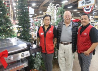 PHOTO: Sally Kilby | The South Pasadenan | One of the auction items featured in the Crunch Time Online Auction is a Blackstone 28" propane griddle donated to SPTOR by Westlake ACE South Pasadena. ACE manager Linda Rodriguez (left) and Manager Oscar Diaz (right) are pictured with Sam Hernandez, Tournament of Roses Association President, next to the BBQ.